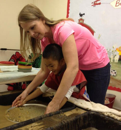 Teacher Debbie Helping Student Prospect for Gold