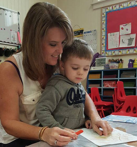 Teacher Shelly Helping Student Color